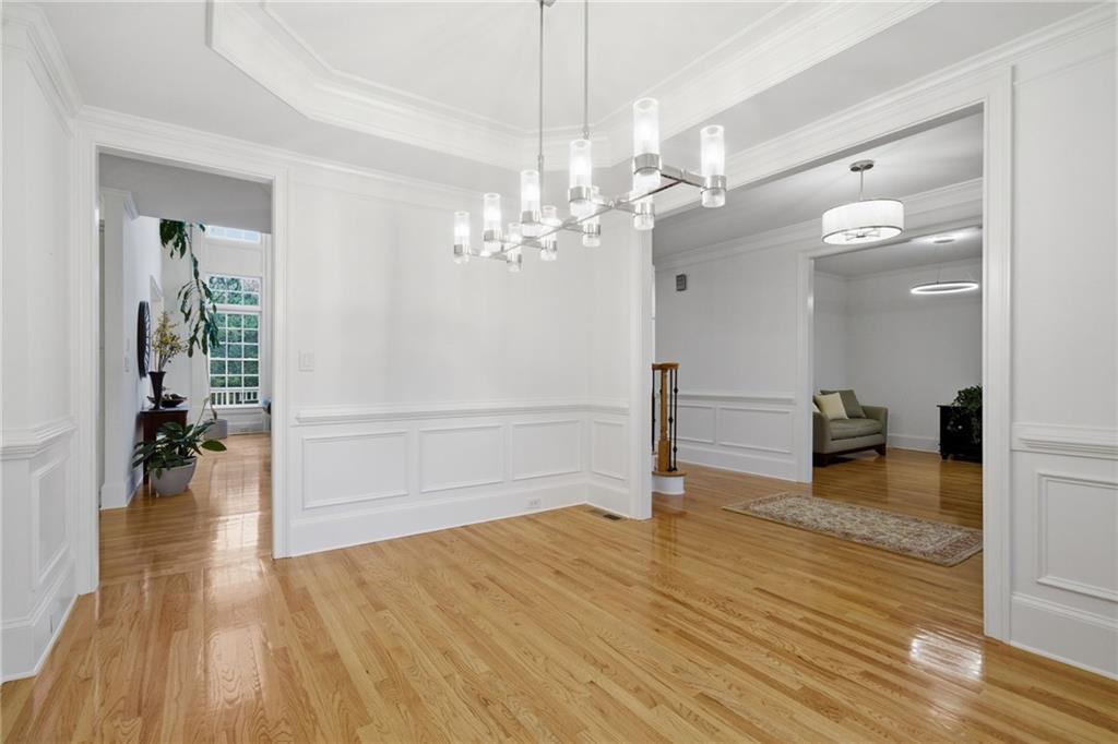 2058 Windermere Crossing Cumming, GA 30041 - Photo 8 of 75 a view of a livingroom with wooden floor and a chandelier