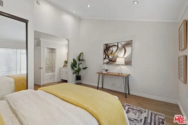 a bedroom with a bed and a table in it