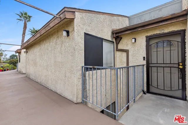 a view of a house with wooden floor and a window