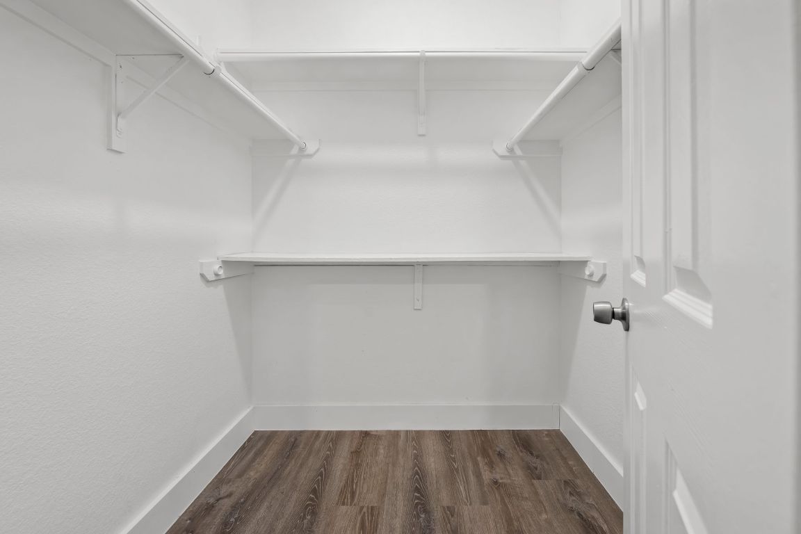 1214 Vargas Road, Unit A Austin, TX 78741 - Photo 14 of 25 Walk in closet with dark wood-style floors