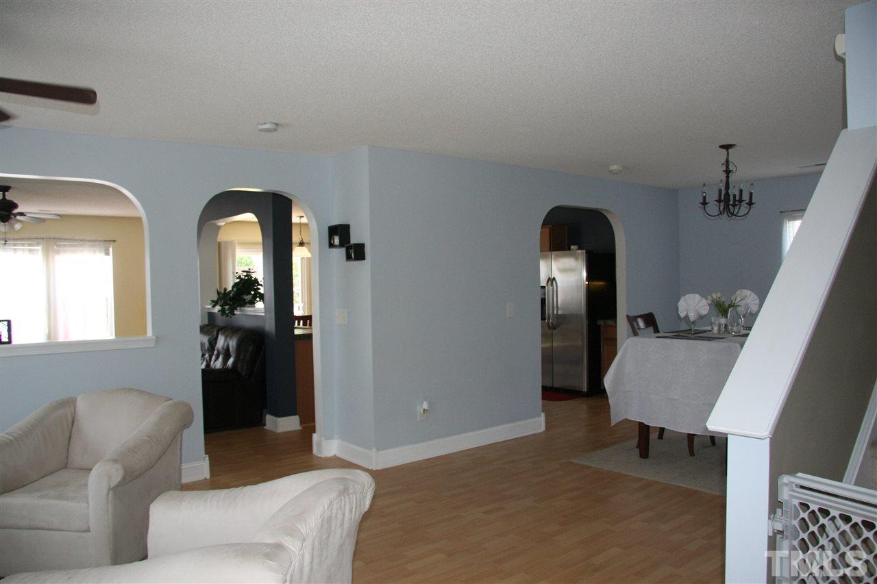 3136 Varcroft Road Knightdale, NC 27545 - Photo 2 of 23 a living room with furniture and a potted plant