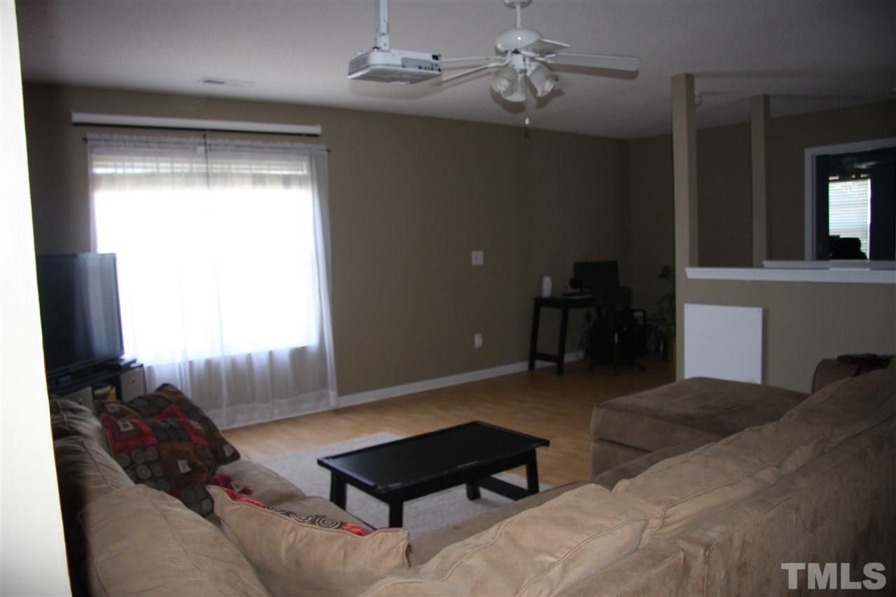 3136 Varcroft Road Knightdale, NC 27545 - Photo 15 of 23 a living room with furniture and a window
