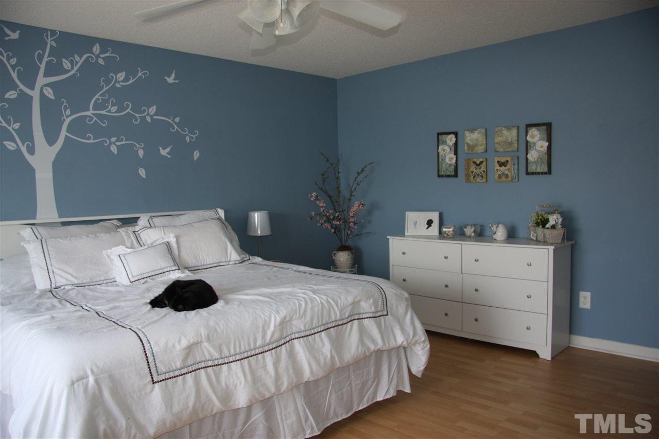 3136 Varcroft Road Knightdale, NC 27545 - Photo 17 of 23 a bedroom with a bed and a cabinets