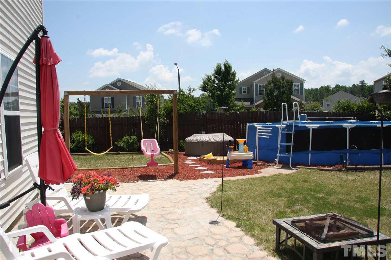 3136 Varcroft Road Knightdale, NC 27545 - Photo 22 of 23 a backyard of a house with outdoor seating