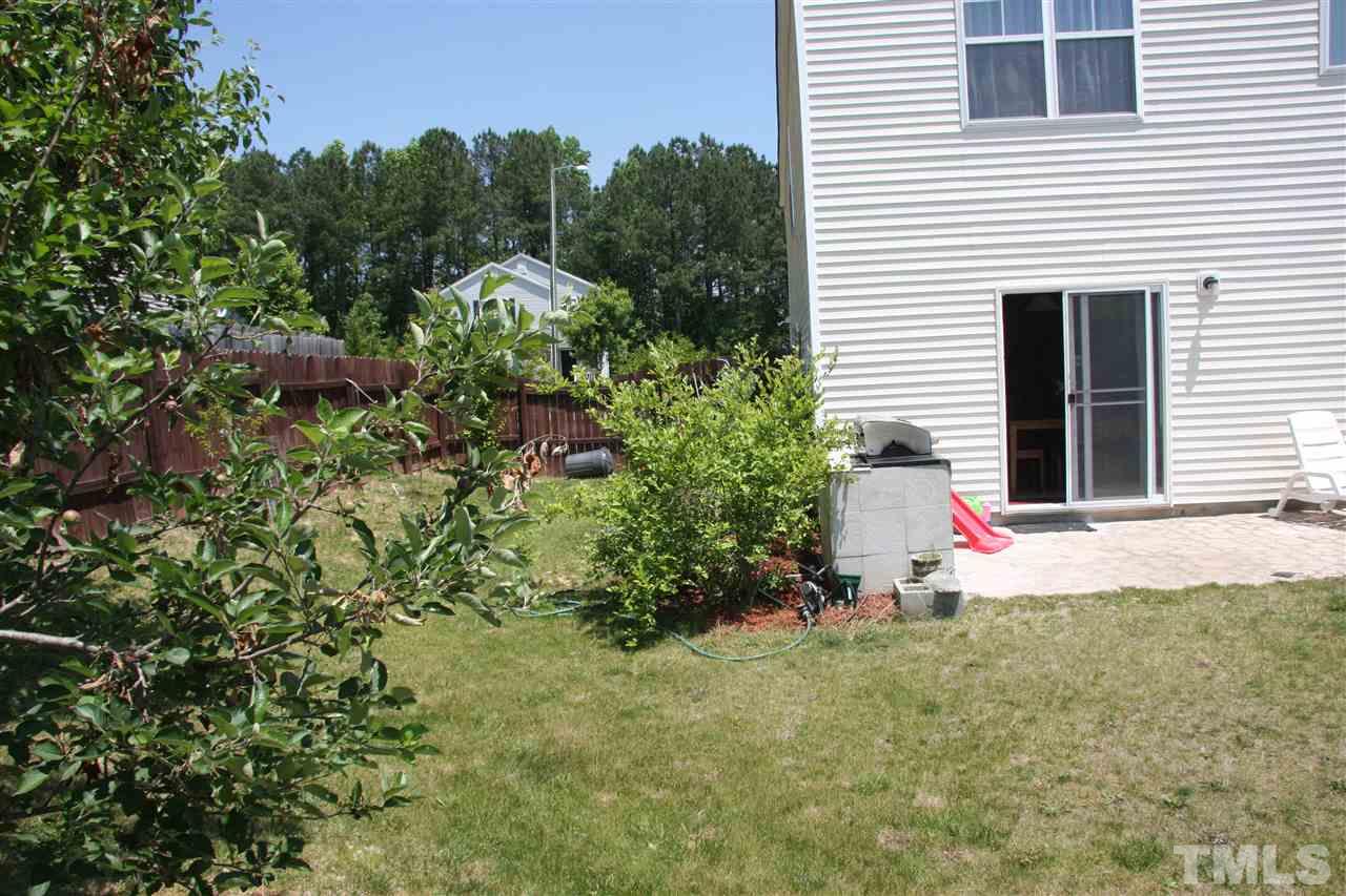 3136 Varcroft Road Knightdale, NC 27545 - Photo 23 of 23 a view of a house with a yard and plant