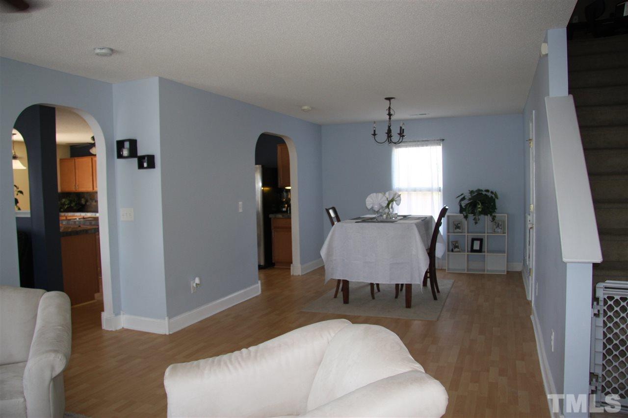3136 Varcroft Road Knightdale, NC 27545 - Photo 4 of 23 a living room with furniture and wooden floor