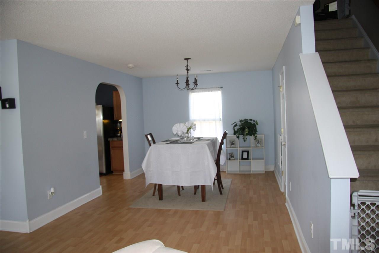 3136 Varcroft Road Knightdale, NC 27545 - Photo 5 of 23 a living room with furniture and a gate