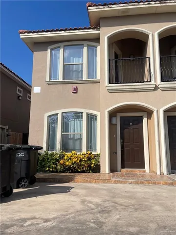 a front view of a house with yard