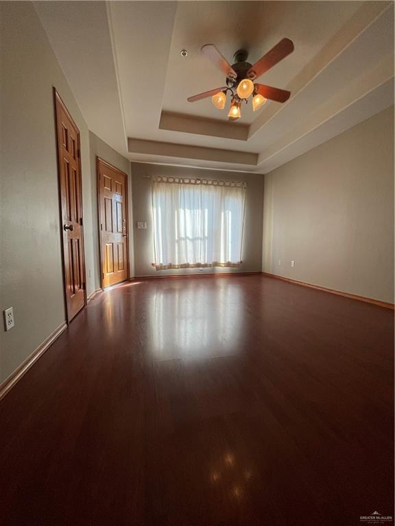 1305 East Olympia Avenue, Unit A McAllen, TX 78503 - Photo 7 of 13 a view of an empty room with a window and wooden floor