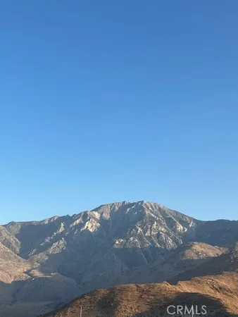 a view of mountain with sunset