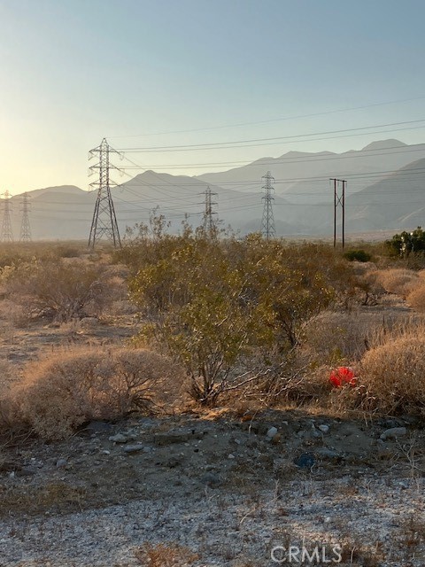 13329 Fremontia Road Cabazon, CA 92230 - Photo 4 of 6 a view of a dry yard with wooden fence