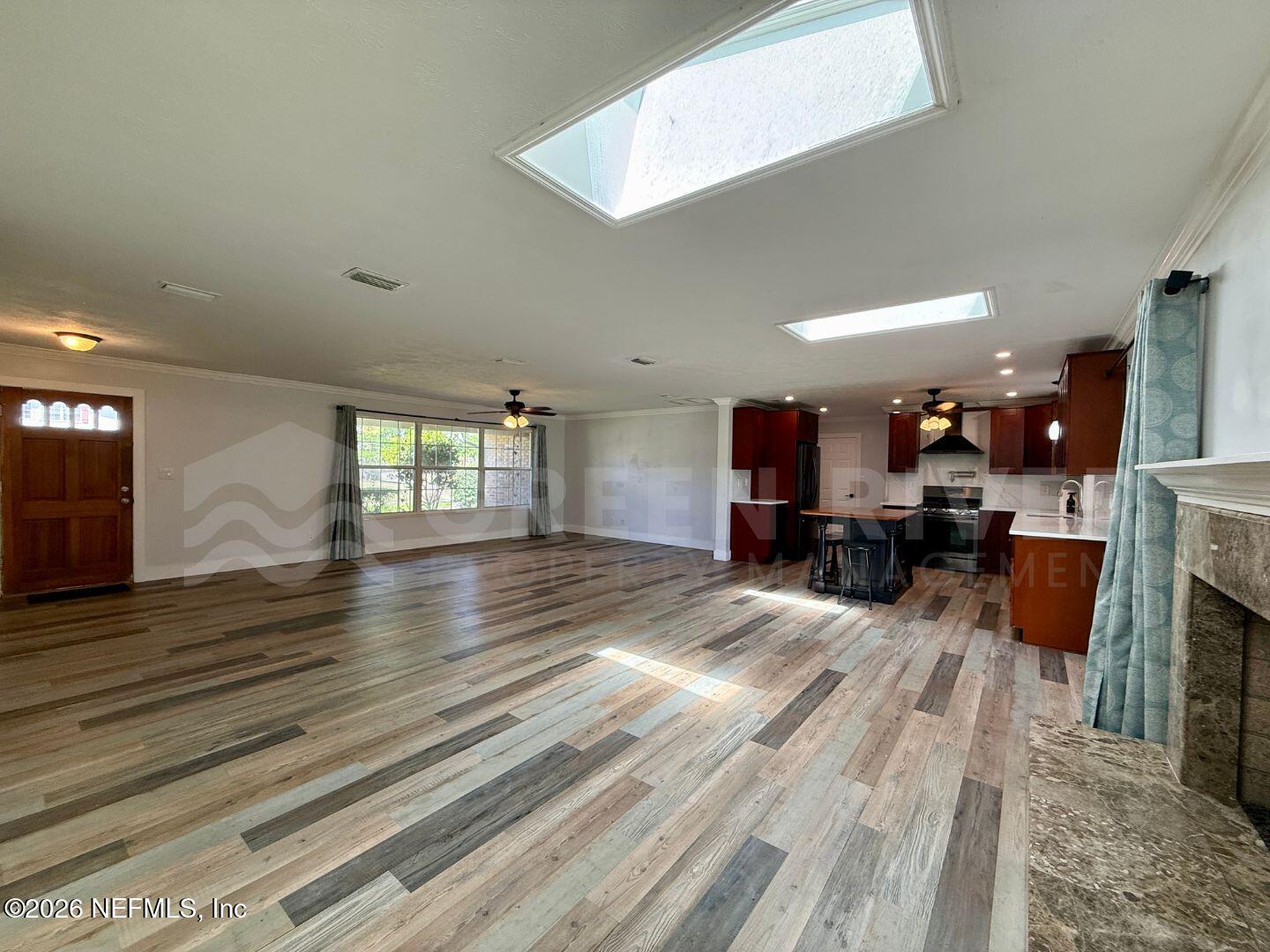 2 Fairway Road Jacksonville Beach, FL 32250 - Photo 11 of 39 a view of kitchen with furniture and flat screen tv