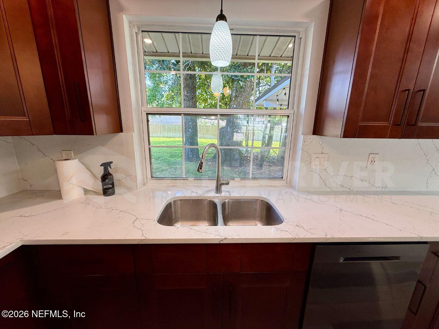 2 Fairway Road Jacksonville Beach, FL 32250 - Photo 15 of 39 a kitchen with a sink and a window