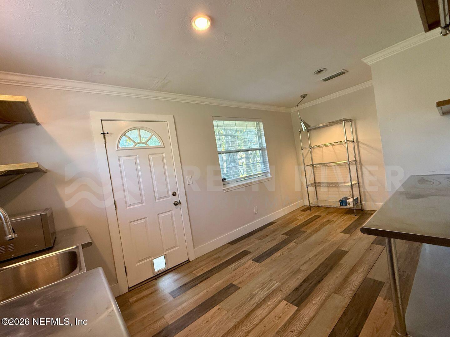 2 Fairway Road Jacksonville Beach, FL 32250 - Photo 18 of 39 a view of a room with wooden floor and window