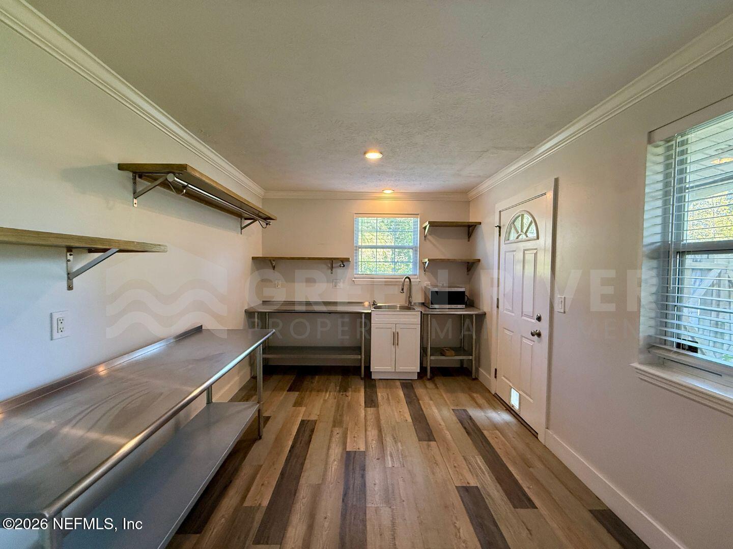 2 Fairway Road Jacksonville Beach, FL 32250 - Photo 19 of 39 a kitchen with a refrigerator and a sink