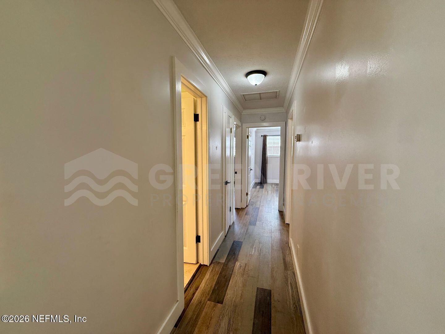 2 Fairway Road Jacksonville Beach, FL 32250 - Photo 21 of 39 a view of a hallway with wooden floor