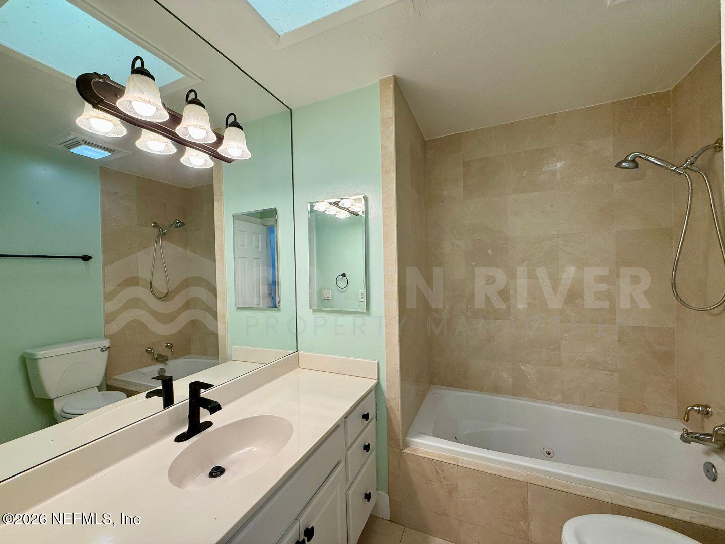 2 Fairway Road Jacksonville Beach, FL 32250 - Photo 26 of 39 a bathroom with a sink a toilet and shower