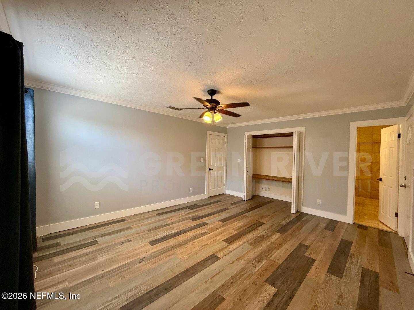 2 Fairway Road Jacksonville Beach, FL 32250 - Photo 29 of 39 a view of a livingroom with a chandelier fan and wooden floor