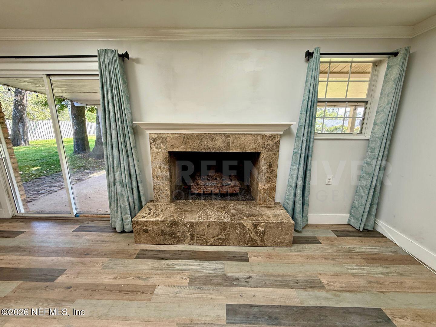 2 Fairway Road Jacksonville Beach, FL 32250 - Photo 10 of 39 a living room with a fireplace and a fireplace