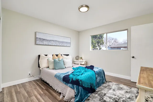 a bed room with a bed and a window