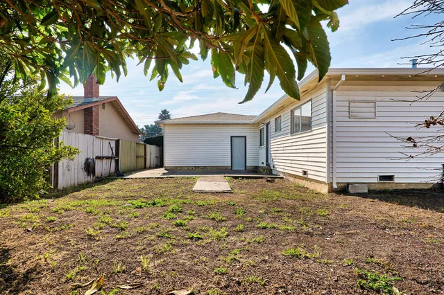 a house with a tree in front of it