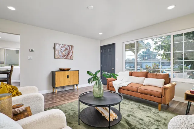 a living room with furniture and a table