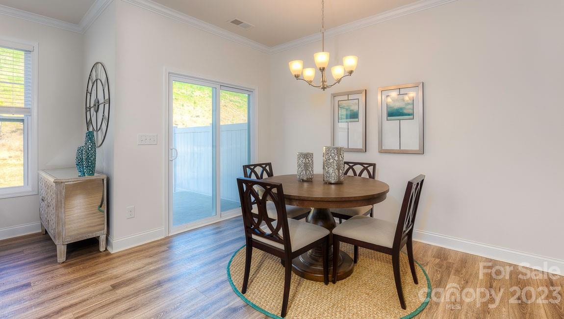 43 Ravens Rdg Road Hendersonville, NC 28792 - Photo 11 of 27 a view of a dining room with furniture and window