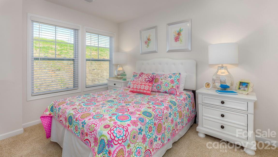 43 Ravens Rdg Road Hendersonville, NC 28792 - Photo 21 of 27 a bedroom with a bed and a window