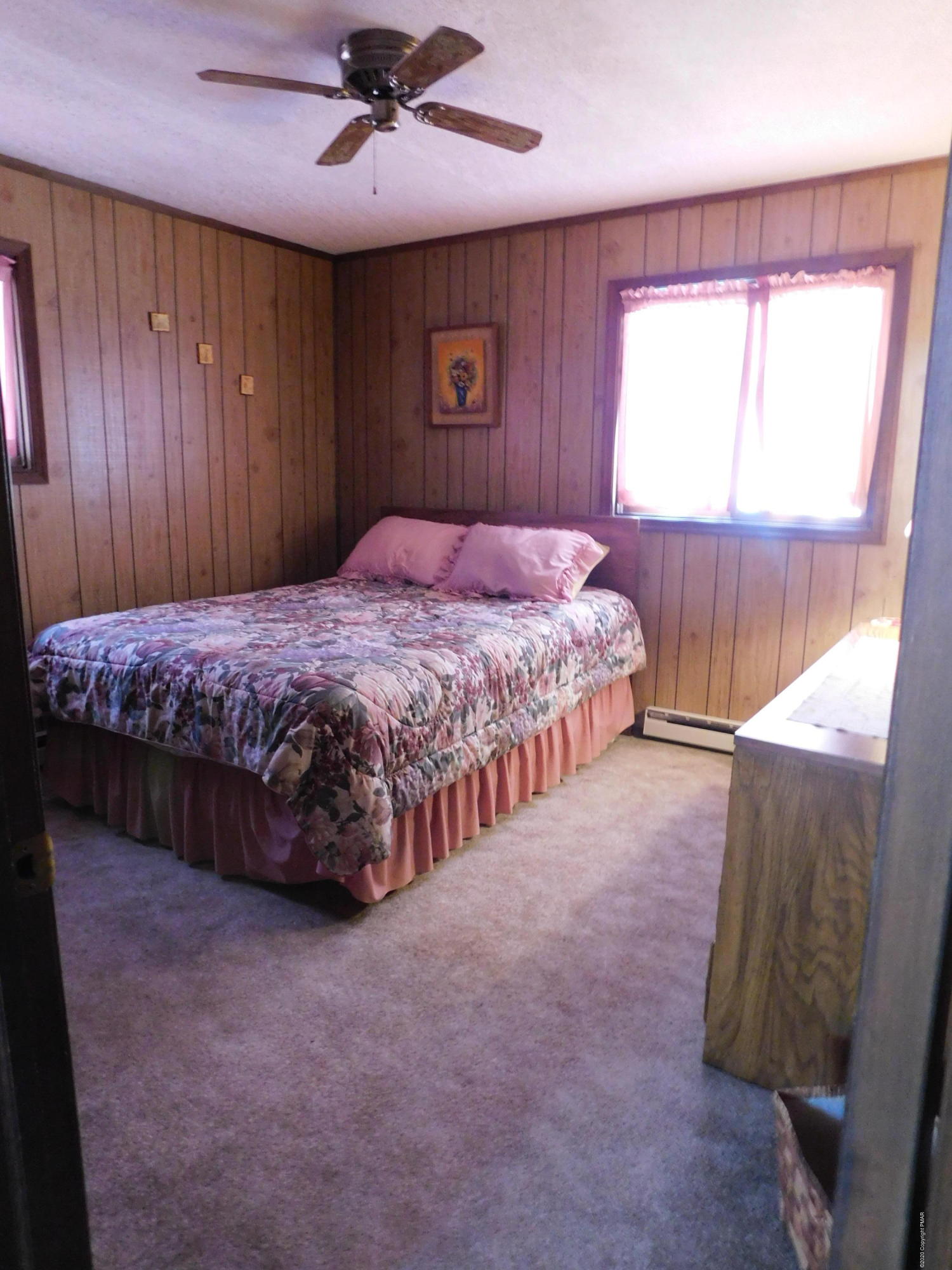 200 Canterbury Road Bushkill, PA 18324 - Photo 27 of 48 a bedroom with a bed and a window