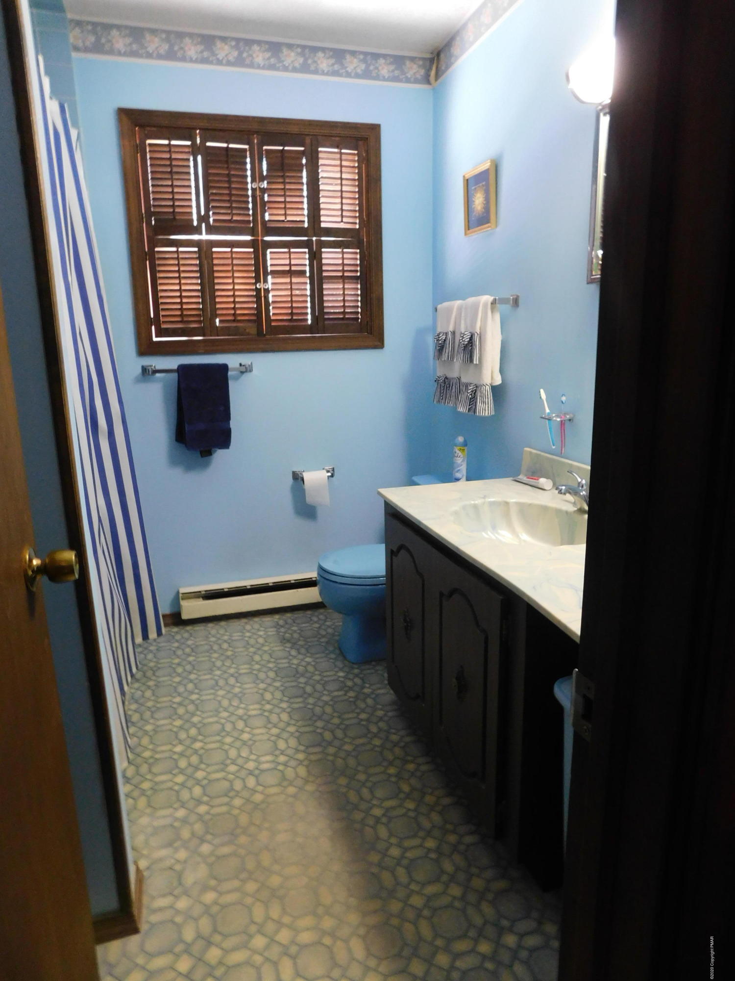 200 Canterbury Road Bushkill, PA 18324 - Photo 29 of 48 a bathroom with a sink a toilet and shower