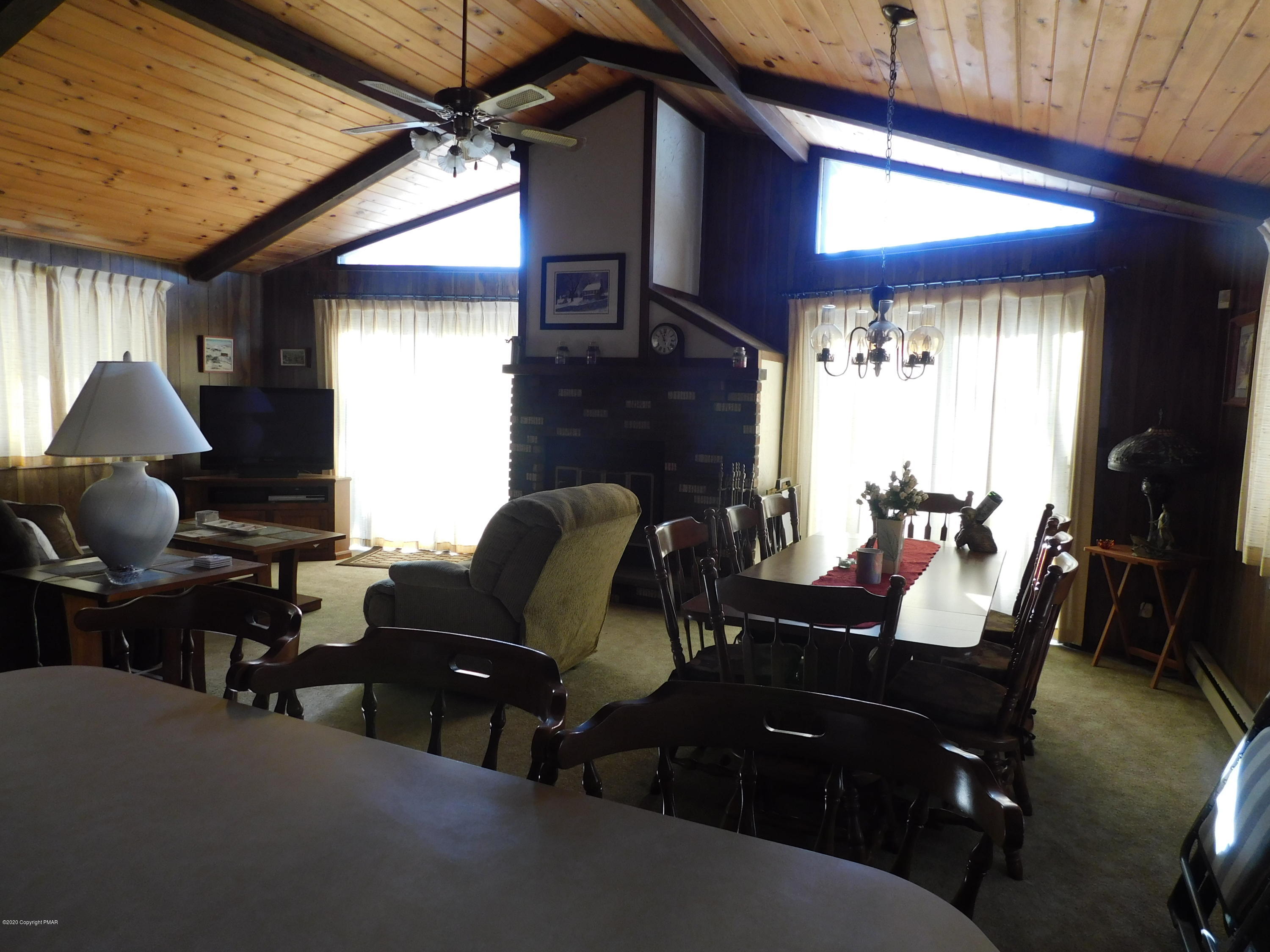 200 Canterbury Road Bushkill, PA 18324 - Photo 30 of 48 a living room with furniture windows and a fireplace