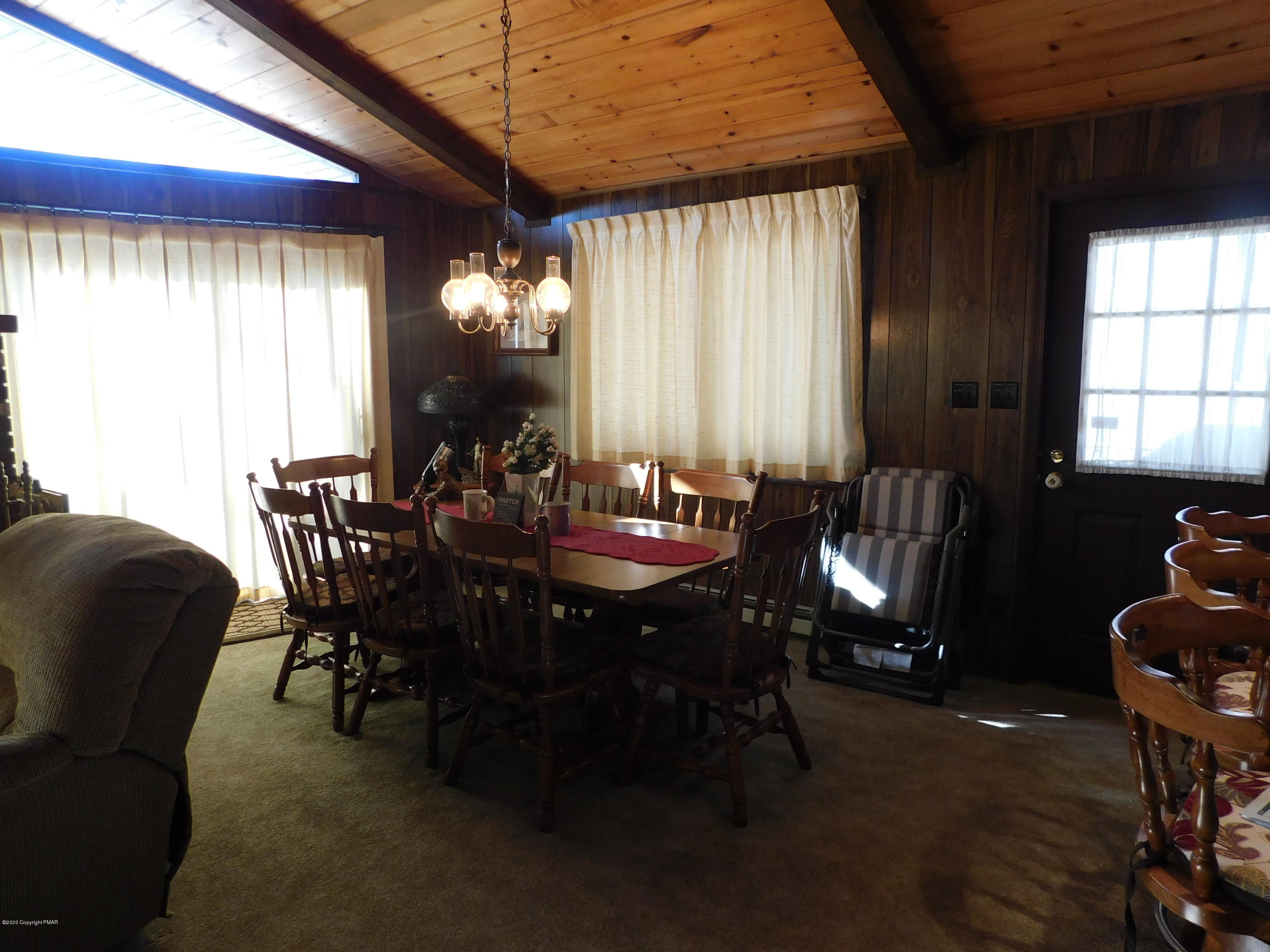 200 Canterbury Road Bushkill, PA 18324 - Photo 32 of 48 a view of a dining room with furniture and chandelier