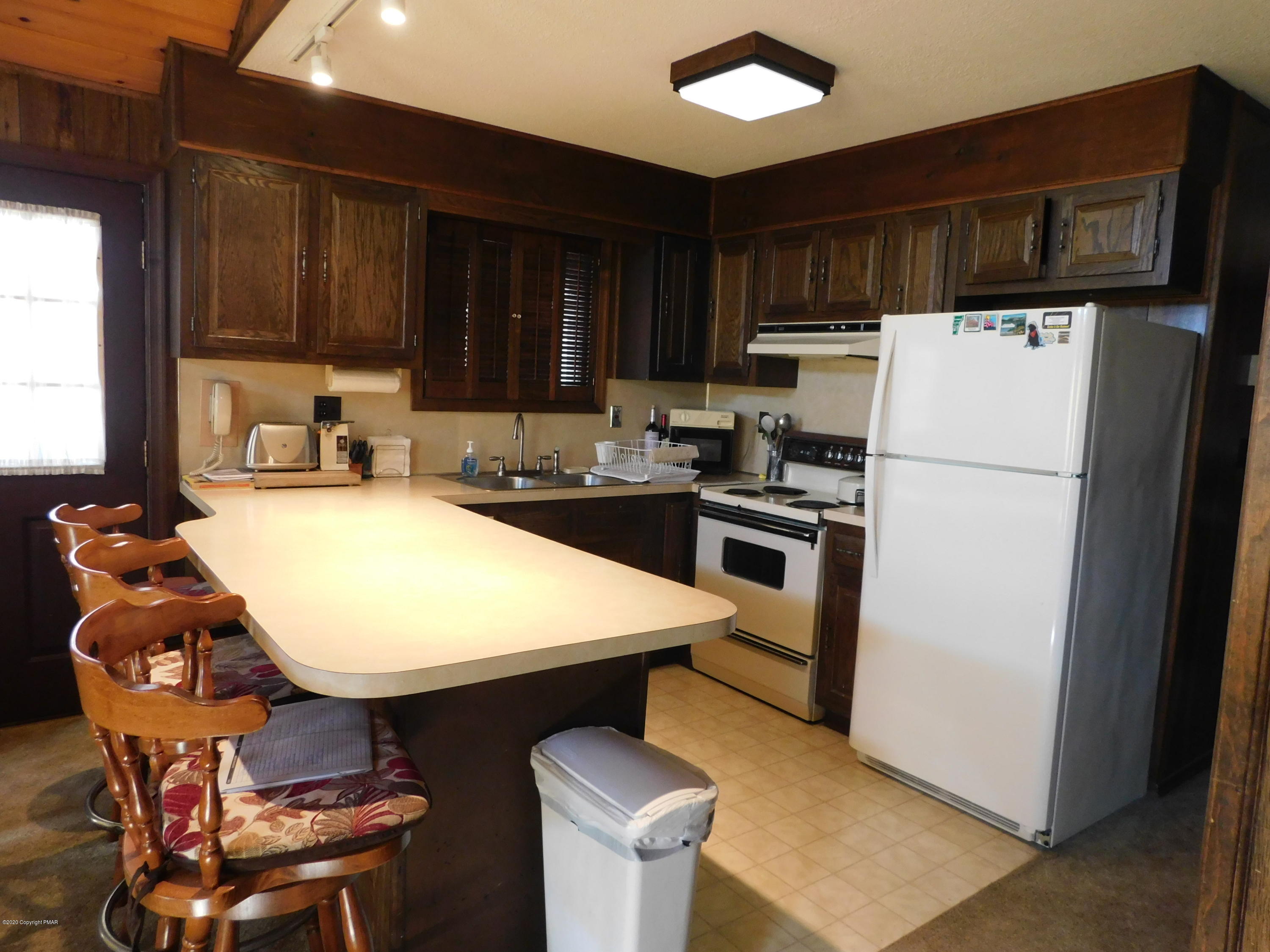 200 Canterbury Road Bushkill, PA 18324 - Photo 4 of 48 a kitchen with stainless steel appliances a stove a sink and a refrigerator