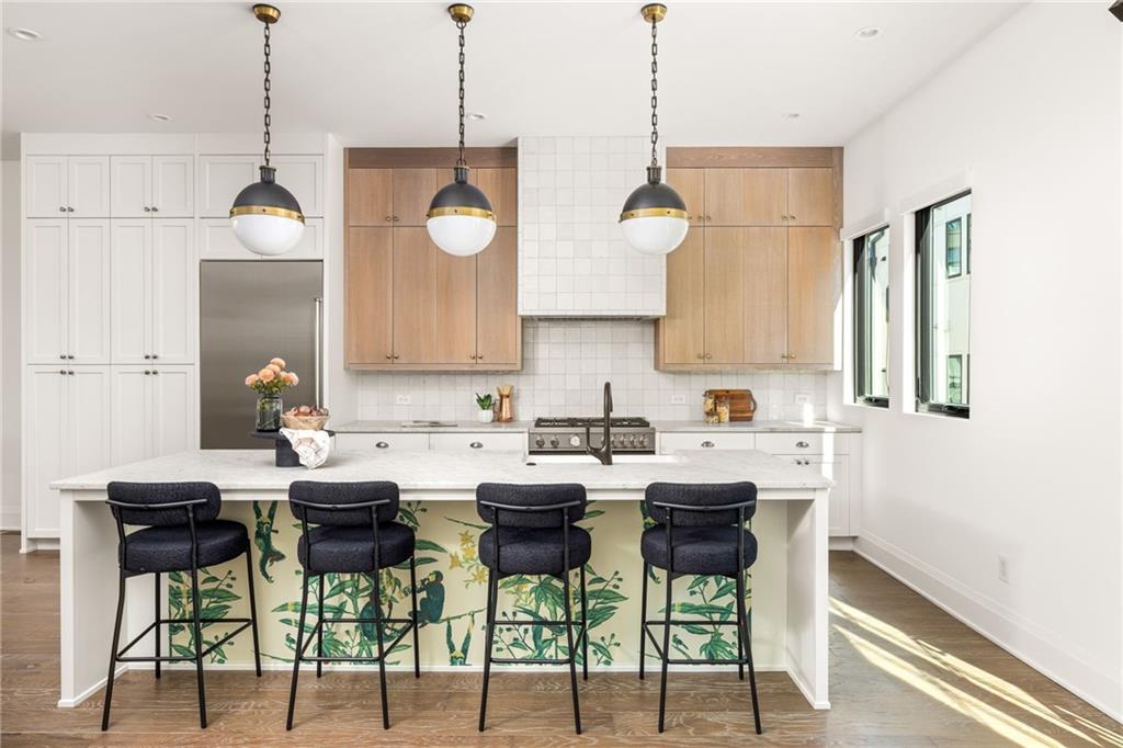 a kitchen with a table and chairs in it