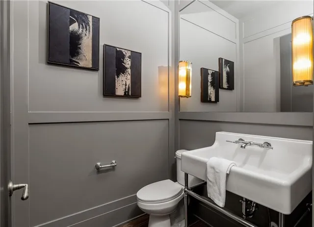 a bedroom with a bed and a night stand