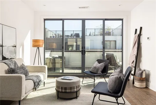 a dining room with furniture and wooden floor