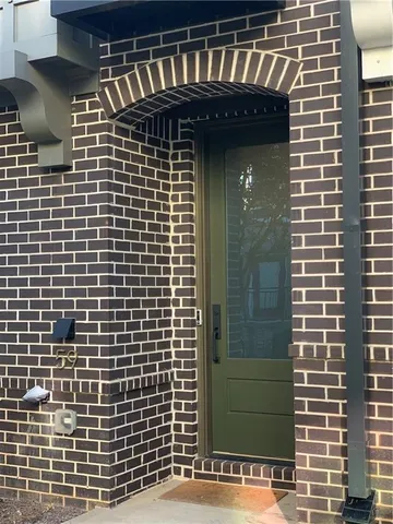 a view of hallway with furniture and a window