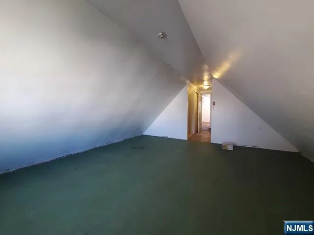 a view of an empty room with stairs