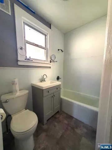 a bathroom with a sink toilet and a bathtub