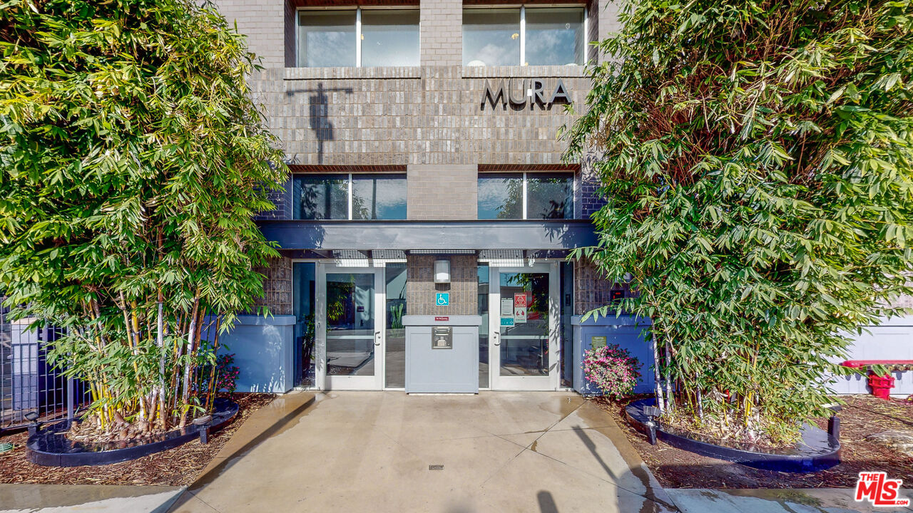 Traction Avenue Los Angeles, CA 90013 - Photo 1 of 1 front view of a house with a small yard