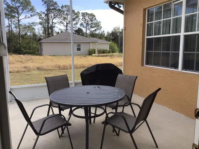 a view of a outdoor seating area with furniture and wooden floor