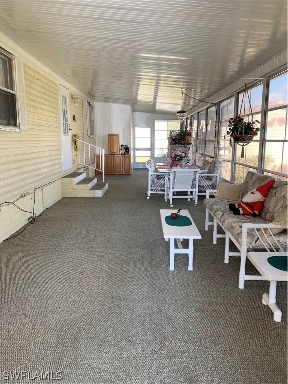 7680 Helen Road Bokeelia, FL 33922 - Photo 2 of 11 a room with gym equipment and a large window