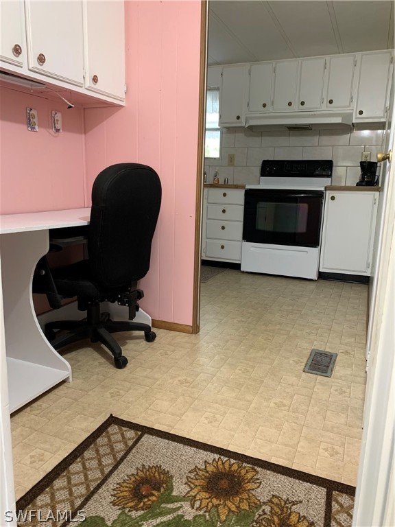 7680 Helen Road Bokeelia, FL 33922 - Photo 3 of 11 a kitchen with a stove and a cabinet