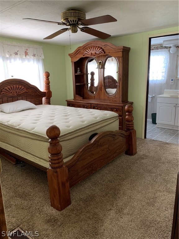 7680 Helen Road Bokeelia, FL 33922 - Photo 7 of 11 a bedroom with a bed and a mirror