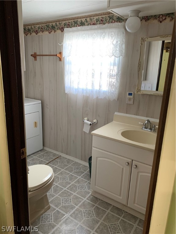 7680 Helen Road Bokeelia, FL 33922 - Photo 8 of 11 a bathroom with a sink a toilet and shower