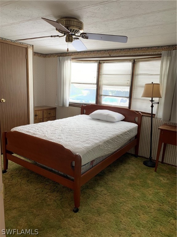 7680 Helen Road Bokeelia, FL 33922 - Photo 9 of 11 a bed sitting in a room next to a window