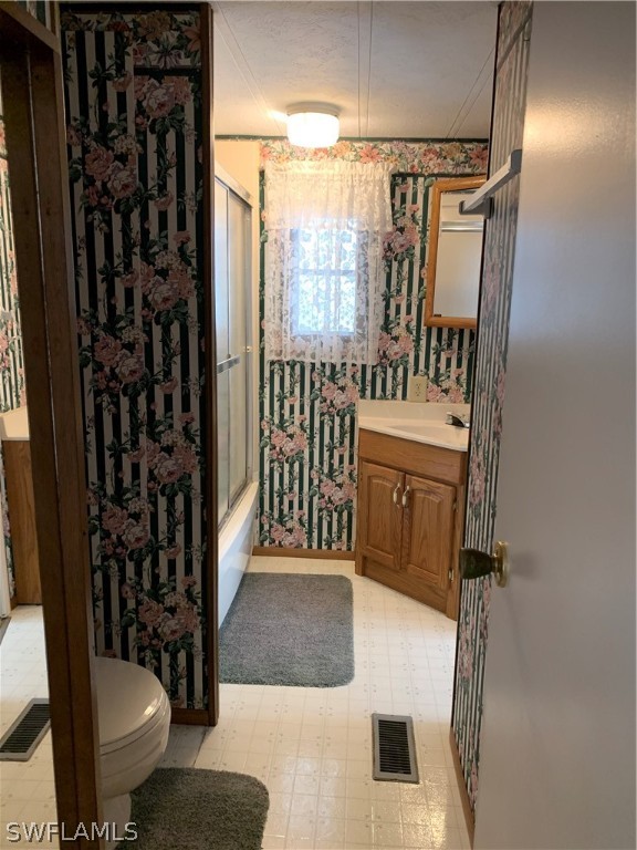 7680 Helen Road Bokeelia, FL 33922 - Photo 10 of 11 a bathroom with a sink toilet and shower