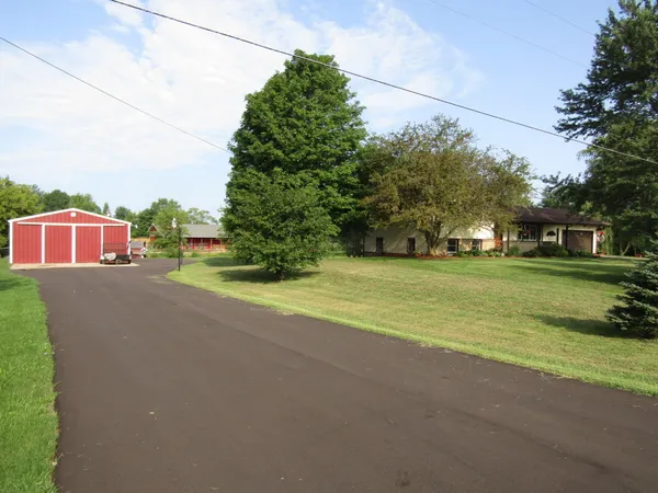 $425,000 | 8453 Hanna Lake Avenue Southeast, Caledonia, MI 49316