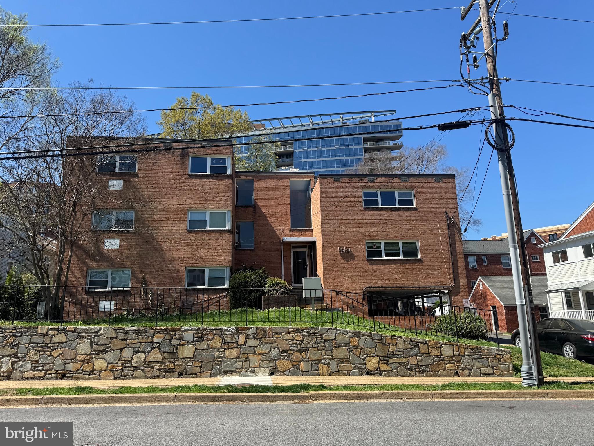 1510 North Rolfe Street, Unit 4 Arlington, VA 22209 - Photo 1 of 9 a front view of a house with garden