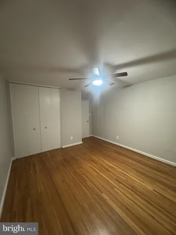 a bathroom with a toilet a sink a mirror and bathtub